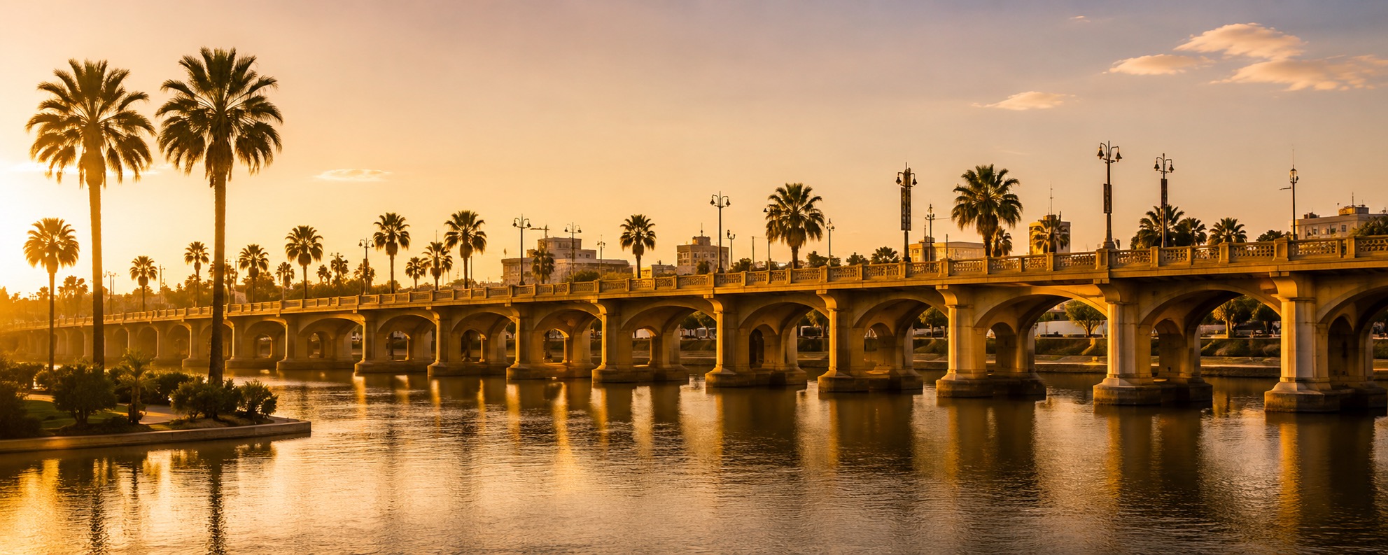 McAllen and Rio Grande Valley skyline at sunset with the International Bridge and palm trees